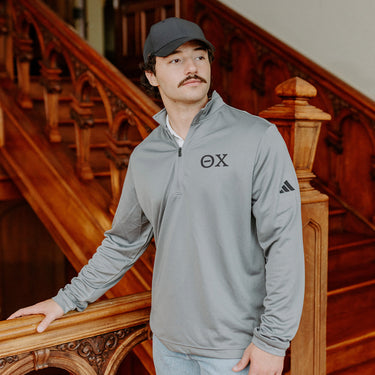 Theta ChiFraternity Grey Adidas Lightweight Performance 1/4 Zip with Greek letters.