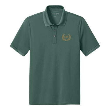 Front view of Green polo featuring embroidered laurel design.