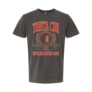 Theta Chi Collegiate Crest Graphic Tee in charcoal grey featuring bold Theta Chi lettering, fraternity crest, Greek letters, and established year design.